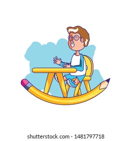 little student boy sitting in school desk with pencil