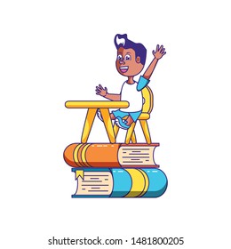 little student boy sitting in school desk with stack books