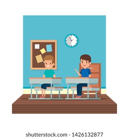 little students boys seated in school desk on the classroom
