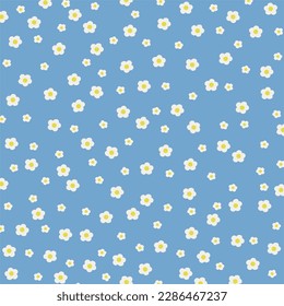 little white flowers on blue background pattern