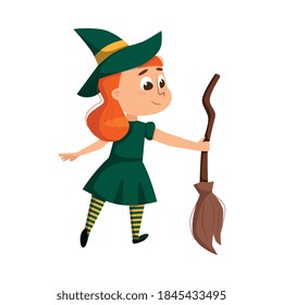 Little Witch Holding Broom, Cute Redhead Girl Wearing Green Dress and Hat Practicing Witchcraft Cartoon Style Vector Illustration