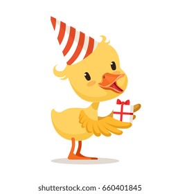 Little yellow duckling in a party hat holding gift box, cute emoji character vector Illustration