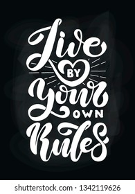 Live by your own rules. Positive inspirational quote on dark chalkboard. Handwritten lettering. Vector illustration about positive thinking for greeting card, poster and banner template.
