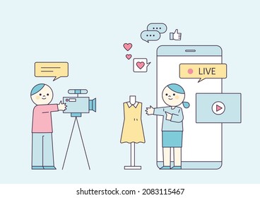 Live Commerce. The Show Host Explains The Product And The Cameraman Is Shooting. People Are Reviewing On The Mobile Screen. Flat Design Style Vector Illustration.