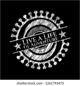 Live a Life of Adventure chalk emblem written on a blackboard