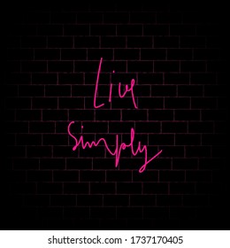 Live Simply hand lettering with pink neon on black brick wall background.