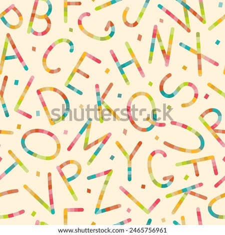 A lively and colorful array of jumbled letters forms an abstract pattern, creating a whimsical and vibrant design reminiscent of childhood playfulness and creative expression.
