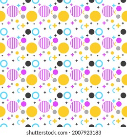 Lively and colorful pattern featuring circles in yellow, pink, blue, and black, mixed with crescent shapes and tiny crosses, all arranged in a playful, rhythmic composition on a white background.