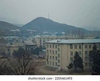 Living blocks in the city of Akhaltsikhe, Georgia. Panoramic winter view, 2008. Vector image.
