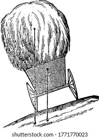 A load of hay, upsets where one wheel rises by little above the other, because, on the top it is broader, than the distance of the wheels from each other, vintage line drawing or engraving.