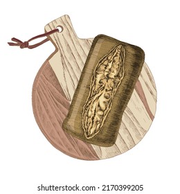 Loaf of baked sourdough bread on a wood plank