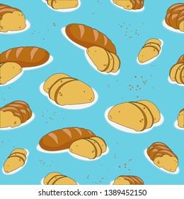 
Loaves of white bread with sliced ​​pieces and buns on a blue background covered with crumbs