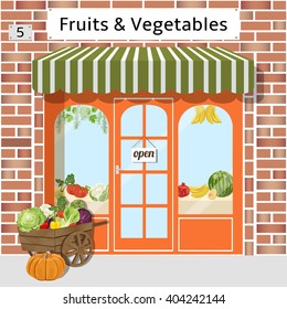 Local fruit and vegetables store building. Cart with vegetables at the fore. Vector illustration. EPS 10.