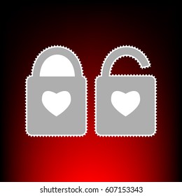 lock sign with heart shape. A simple silhouette of the lock. Shape of a heart. Postage stam or old photo style on red-black gradient background.