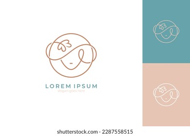 Logo of beautiful woman wearing hat with flower decoration