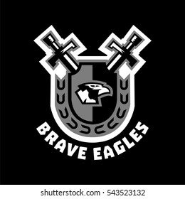 Logo brave eagles. Eagle head located on the shield. Swords and wreath. Black and white color sticker. The emblem on the Middle Ages and the war. Vector illustration. Flat style.