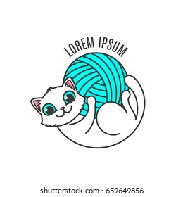 Logo with cat in circle composition. Little kitten lies on the back and hold in own paws yarn ball. Logotype for handmade company or shop