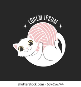 Logo with cat in circle composition. Little kitten lies on the back and hold in own paws yarn ball. Logotype for handmade company or shop
