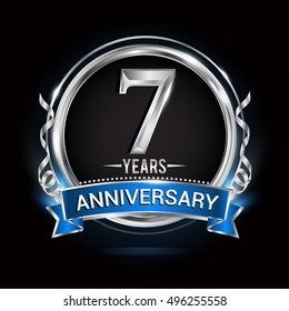 Logo celebrating 7 years anniversary with silver ring and blue ribbon.