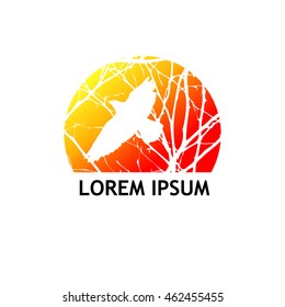 Logo circle of tree branches with a bird. Vector