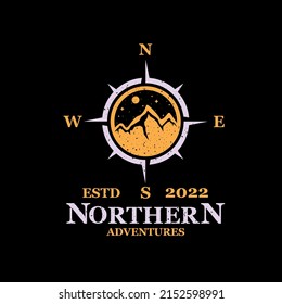 logo of a climbing community from the north with a compass shape in which there is an image of a mountain