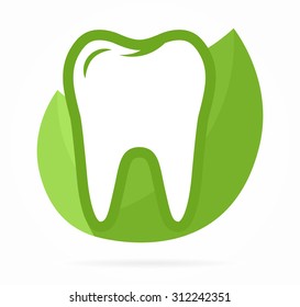 Logo combination of tooth on green leafs 