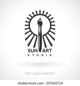 Logo concept of brush shining like the Sun for art studio. Bright brush is shining around like a lighthouse.