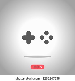 Logo of console or mobile game, controller or joystick, simple icon. Icon under spotlight. Gray background