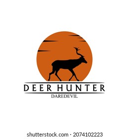 A logo of a deer silhouette and a view at dusk which is perfect for the logo of a hunter community or a community of nature lovers