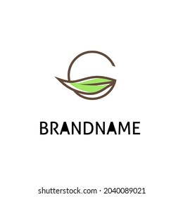 logo design letter G and green leaves,