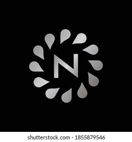 Logo Design for Letter N. Silver Letter N logo design isolated on black background.Silver Vector jewelry concept.