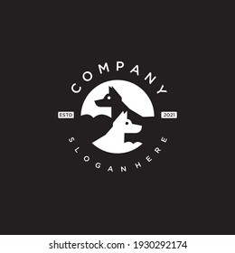 logo design of two dogs silhouettes in a circle