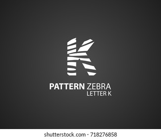The logo design is a zebra skin pattern, in combination with the letter K