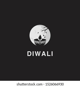 logo of diwali with candle under the moon in the black background