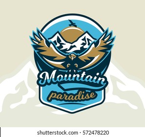 Logo, emblem of an eagle flying. Mountains, rocks. Badges shield, lettering. Freeride, downhill, cross-country. Vector illustration.