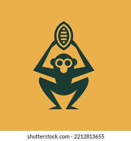 Logo or icon of a monkey holding a cocoa pod towards the sky.