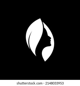 a logo illustration of a combination of a woman's face with a variety of leaves