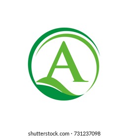 A logo initial letter design template vector inside semi circle shape with leaf accent.