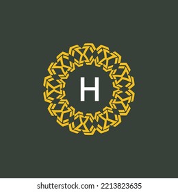 logo initials letter H. circle emblem with ethnic pattern. round ornament logo