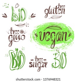 Logo label bio, vegan, natural on a green background.Gmo free, calligraphic handwriting lettering with leaf, cube, drop. natural food sticker eps 10