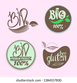Logo label eco, bio, natural on a white background.Gmo free, calligraphic handwriting lettering with leaf, cube, drop. natural food sticker eps 10