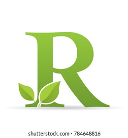 Logo with letter R of green color decorated with green leaves - Vector image