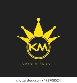 Logo letters K and M yellow crowned. Crown logotype design template on black background