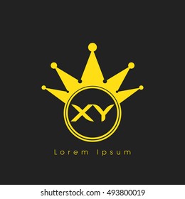 Logo letters X and Y yellow crowned. Crown logotype design template on black background