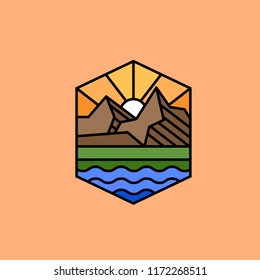 the logo with the mountains, the sunset and the river, on a brown background
