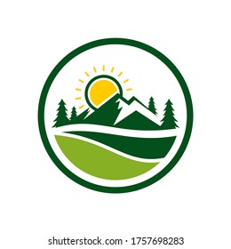 Logo Nature of the mountain landscape with cypress trees and sun circle shape