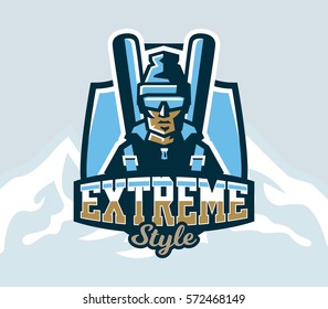 Logo on skiing. Emblem of skier in a cap and ski glasses, backpack and skis. Extreme winter sport. Isolated mountains in the background. Badges shield, lettering. Vector illustration.