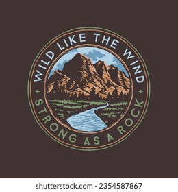 A logo for a rock mountain with a blue river called wild like the wind strong as a rock