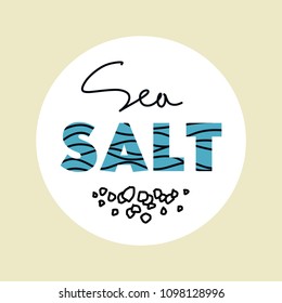 Logo Sea Salt With A Picture Of Grains Of Salt.