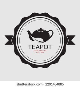 a logo suitable for a shop selling tea complete with leaves and a teapot